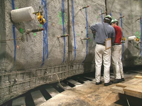 The shotcrete is partly applied in two work cycles. In order to ensure the required stability of the lining, there must be a very good bond between the concrete layers.  To meet this requirement, concrete must always be placed on solid and rough surfaces. This photo was taken during the testing of concrete tensile strengths.